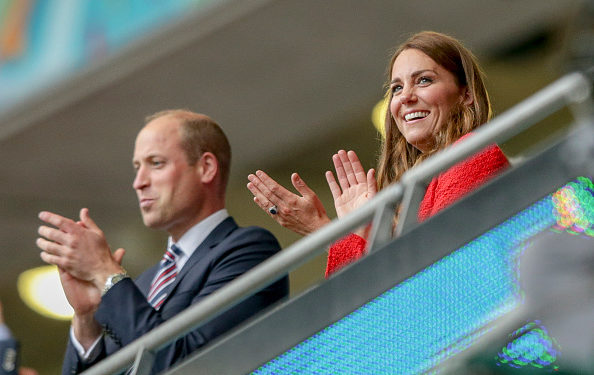 LONDON, ENGLAND - JUNE 29: Prince William, Duke of Cambridge and Catherine, Duchess of Cambridge get to their feet to celebrate after Harry Kane of England scores a goal to make it 2-0 during the UEFA Euro 2020 Championship Round of 16 match between England and Germany at Wembley Stadium on June 29, 2021 in London, England. (Photo by Robin Jones/Getty Images)