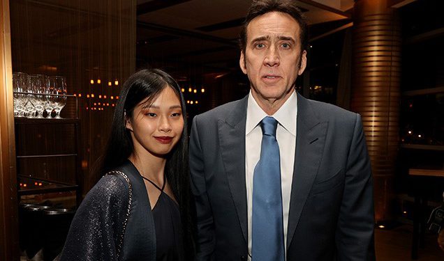 WEST LOS ANGELES, CALIFORNIA - JULY 13: Nicolas Cage (R) and Riko Shibata pose at the after party for the premiere of Neon's "Pig" at Craft Restaurant on July 13, 2021 in West Los Angeles, California. (Photo by Kevin Winter/Getty Images)