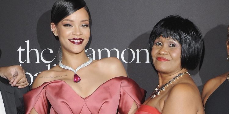 BEVERLY HILLS, CA - DECEMBER 11:  Rihanna and mom Monica arrive at Rihanna's First Annual Diamond Ball at The Vineyard on December 11, 2014 in Beverly Hills, California.  (Photo by Jon Kopaloff/FilmMagic)