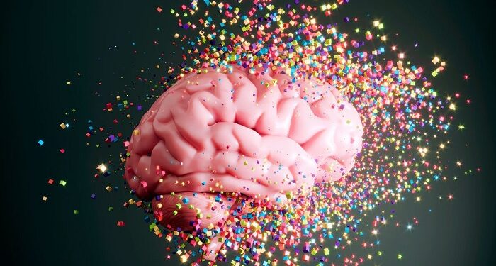 Dissolving multi colored cubes flying to the human brain. (3d render)
